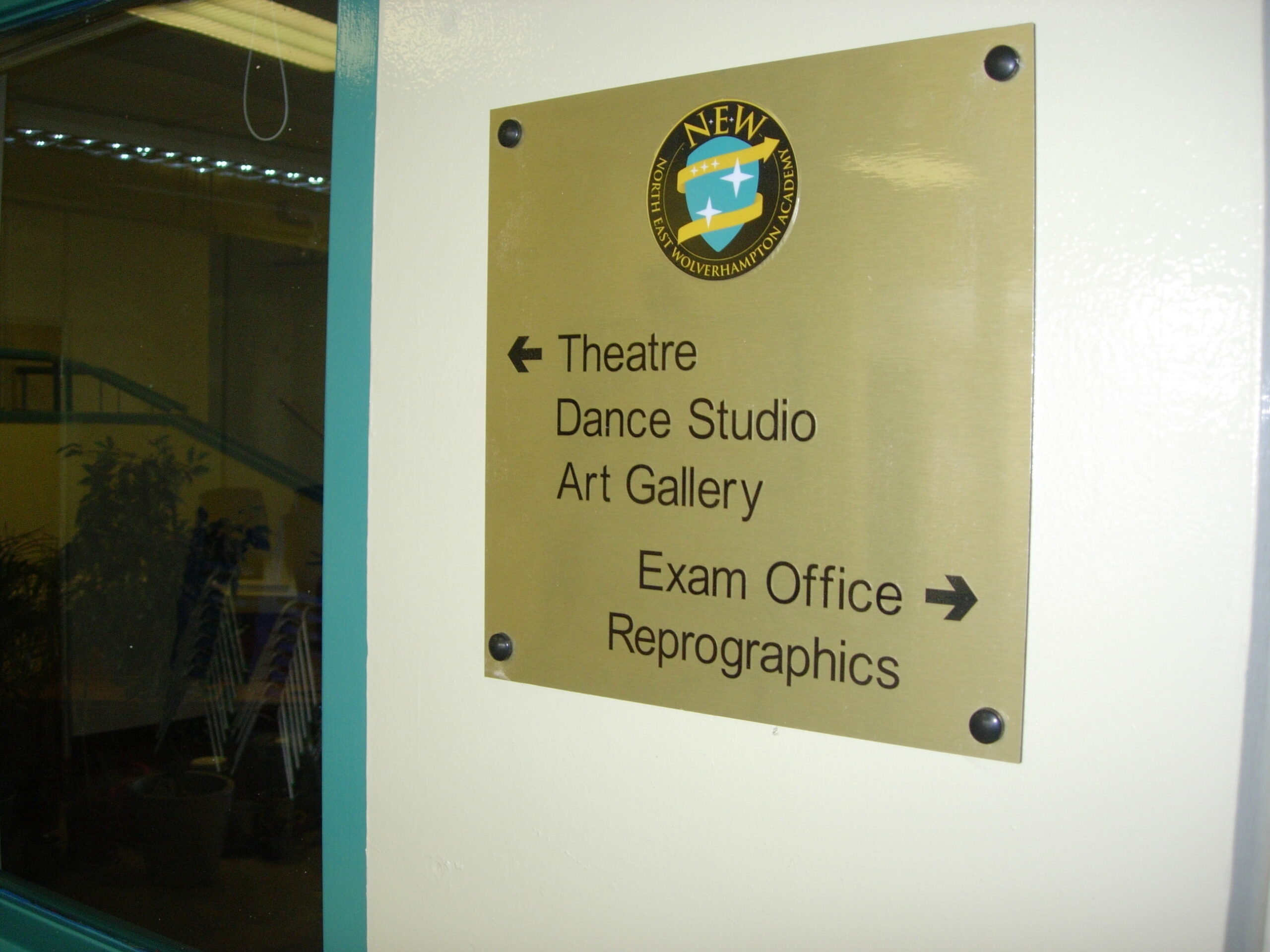 Internal school signage used for room identification and wayfinding