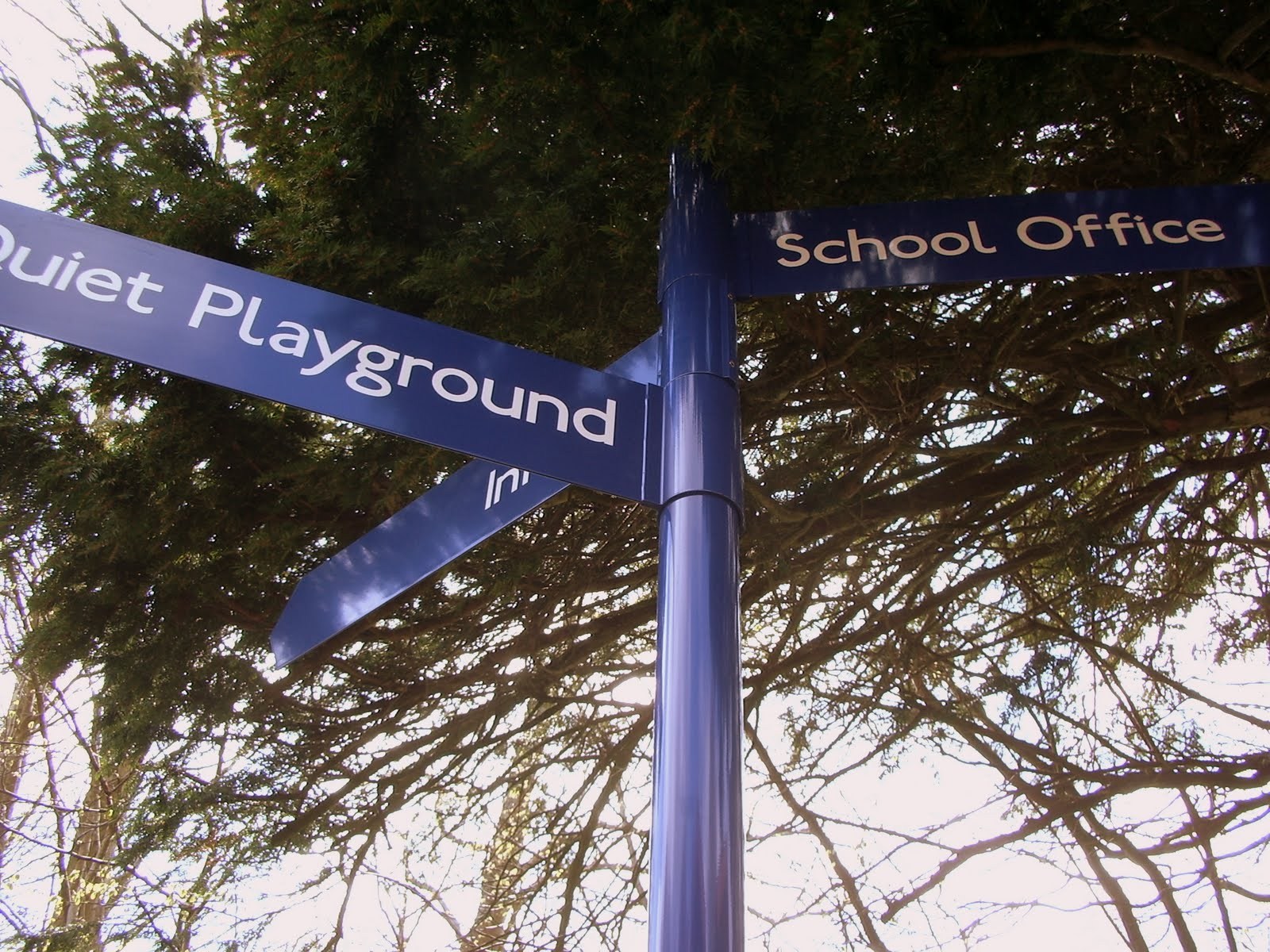 Fingerpost directional signs installed on a school campus